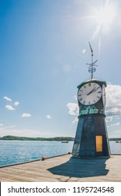 low angle view of clock on wooden pier at oslo harbour, norway
