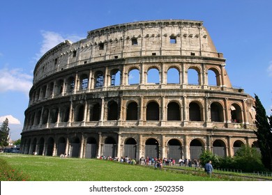 Low Angle view of the Colosseum Amphitheater in Rome against blue sky background. - Shutterstock ID 2502358