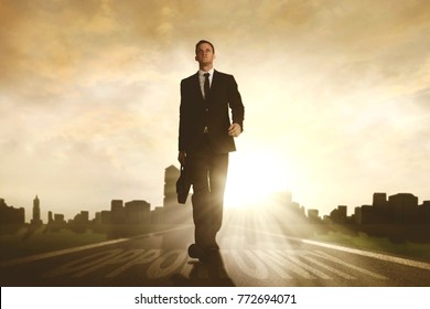 Low angle view of confident businessman carrying a briefcase while walking above opportunity word in the road - Shutterstock ID 772694071