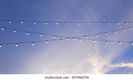 Low Angle View Decorative Lights Against Stock Photo 1074960734