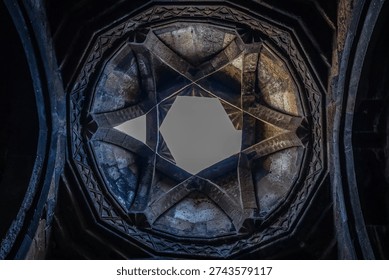 Low angle view of dome of temple or synagogue with hexagram in center. Star of David or Seal of King Solomon in ancient temple Symbol of Israel in stone structure Armenian temple with six pointed star