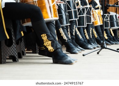 Low angle view of drummers playing on national ossetian drums .