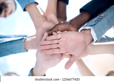 Low angle view of fit people stacking hands - Shutterstock ID 1256677420