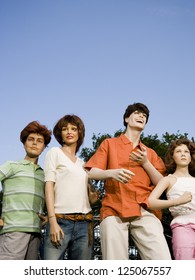 Low Angle View Of Four Mannequins Portraying A Family