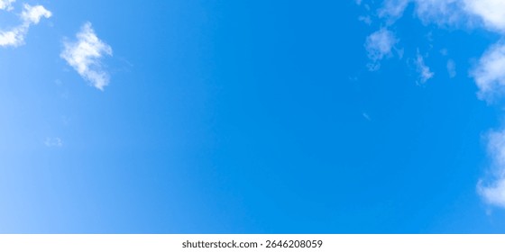 Low angle view and full frame of beautiful blue sky with strange shape of white fluffy of clouds in the morning or evening on sunny day is used as natural background texture in decorative art work.