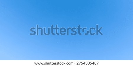 Low angle view and full frame of beautiful light blue sky without clouds in the afternoon on sunny day is used as natural background texture in decorative art work.