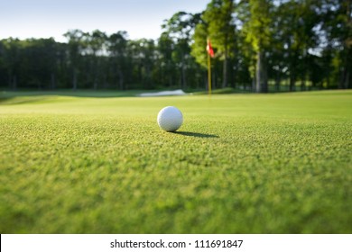 Low Angle View Of Golf Ball On Green