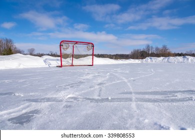 A Low Angle View Of A Hockey Goal. The Net Is Sitting On A Frozen Pond Used To Play Shinny  Is Located In Stouffville Ontario Canada. Shinny Is A Pick Up Game Of Hockey With No Formal Rules.