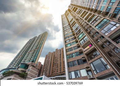 Low Angle View Of Hong Kong Apartment Block In China.