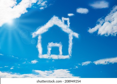 Low angle view of house shaped cloud in blue sky - Powered by Shutterstock