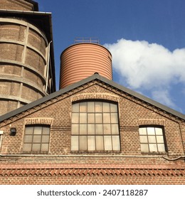 low angle view of industrial buildings in the mill area for the processing of edible flours - Powered by Shutterstock