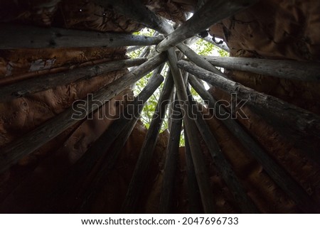 Low angle view of the inside of a wood and birch bark traditional native tipi, Gaspé, Quebec, Canada