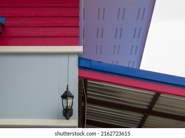 Low Angle View, The Joint Between The Garage Roof And The House, Metal Sheet Roof Without Ceiling, Rafters, Purlin, No Ceiling