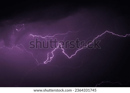 Low angle view of lightning in sky at night