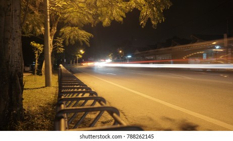 Low angle view of lights trail of vehicle at night.