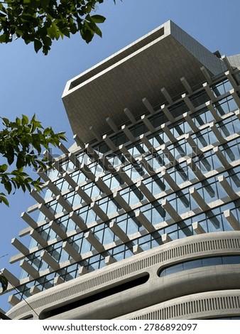 Low angle view looking up at the brutalist and futuristic concrete facade of the HAUS NOWHERE building in Seoul, South Korea. 