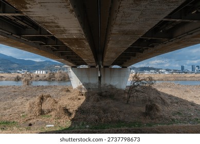 Low angle view looking up at the underside of a concrete bridge