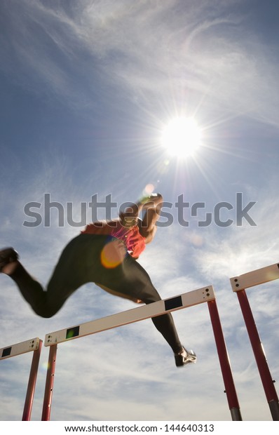 Low Angle View Male Athlete Jumping Stock Photo (Edit Now) 144640313