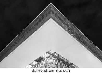 low angle view of modern architecture exterior and sky at night