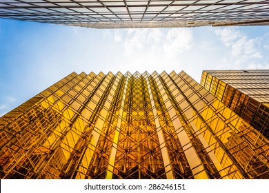 low angle view of modern skyscraper exterior and sky in modern city