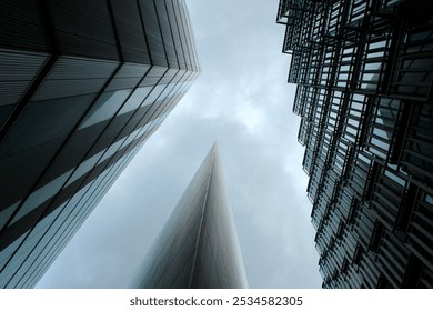 Low Angle View of Modern Skyscrapers in London City – Abstract View of Contemporary Architecture. Greyscale Photography - Powered by Shutterstock