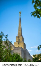 A Low Angle View Of Mormon Church In Utah With Trees Near It At The Sunset