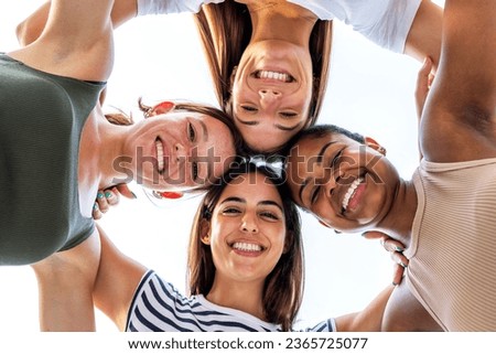 Similar – Young happy people with their heads together having fun in summer party