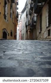 Low Angle View of Narrow Old Town Cobblestone Street