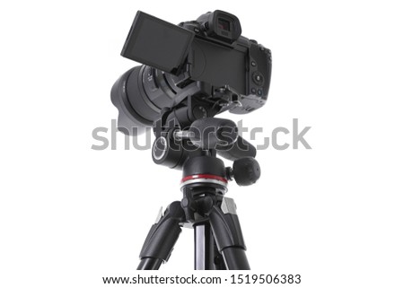 Low angle view on massive black still-shot camera on trepied cutout