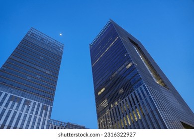 low angle view on office building at night - Powered by Shutterstock