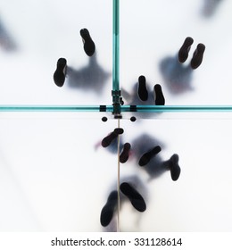 Low Angle View Of People On A Glass Floor