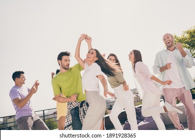 Low angle view photo of young friends excited happy smile carefree have fun enjoy music dance rest rooftop party