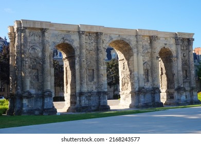 Low angle view of the Porte de Mars (Gate of Mars), a 3th century vestige, and an ancient Roman triumphal arch, located at the end of the Hautes Promenades, in Reims, in the Northeast of France - Shutterstock ID 2168243577