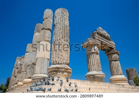Low angle view of reconstructed ancient marble architrave and columns at Temple of Apollo Smintheus in Turkey