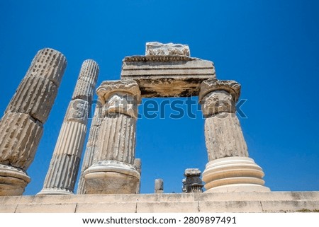 Low angle view of reconstructed ancient marble architrave and columns at Temple of Apollo Smintheus in Turkey