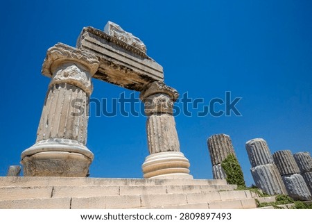 Low angle view of reconstructed ancient marble architrave and columns at Temple of Apollo Smintheus in Turkey
