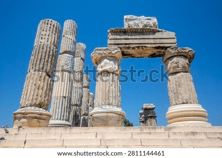 Low angle view of restored marble columns and architrave of ancient Temple of Apollo Smintheus in Turkey