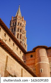 Low Angle View Of The Romanesque Basilica Of Saint Sernin And Its Brick Bell Tower, A UNESCO World Heritage Site In Toulouse, France, And A Place Of Pilgrimage On The Route Of Santiago Of Compostela