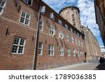 Low angle view Round Tower  in Copenhagen, Denmark, an astronomical observatory; text: Lead God, the right teaching and justice into the heart of the crowned King Christian IV, 1642