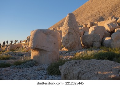 Low Angle View Of Sculptures King Of Commagene During Sunset At Nimrod Mountain, Local Name Is Nemrut Dagi.