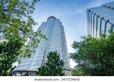 Low angle view of skyscrapers in Jakarta. Skyscrapers and office building with blue sky background - Powered by Shutterstock