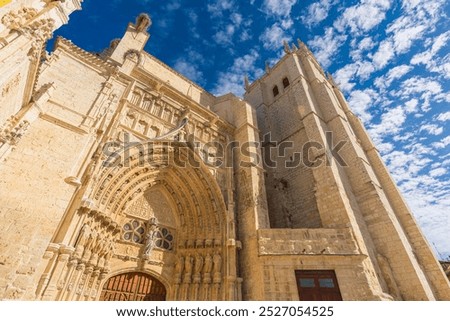 Low angle view of the southern facade of the Catholic Cathedral in the Gothic style of Palencia in Castilla y León Region, Spain