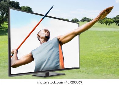 Low angle view of sportsman practising javelin throw against blue sky with clouds - Powered by Shutterstock