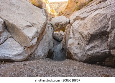 Low Angle View Of Stone Wedged In A Small Slot Canyon In Big Bend Wilderness At Ernst Tinaja