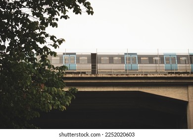 Low angle view of train on railroad bridge against sky