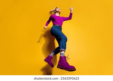 Low below angle full length body size view of nice fit thin slim attractive cheerful girl having fun going making step wearing vintage retro boots isolated over bright vivid shine orange background - Powered by Shutterstock - Get 15% off with code: PIKWIZARD15