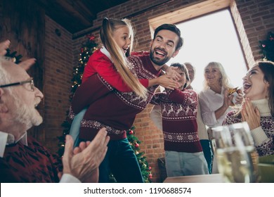 Low below angle view of noel morning couple gathering, tradition. Grey-haired cheerful excited grandparents, grandchildren sister, brother son daughter at house feast lunch table dad piggybacking girl - Powered by Shutterstock