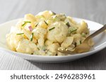 Low Carb Diet Friendly Cauliflower Potato Salad on a Simple White Plate