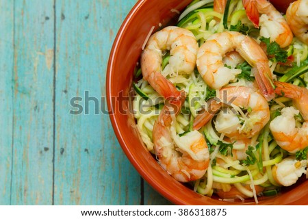 Low carb, high fat meal consisting of shrimp and zucchini and coconut oil