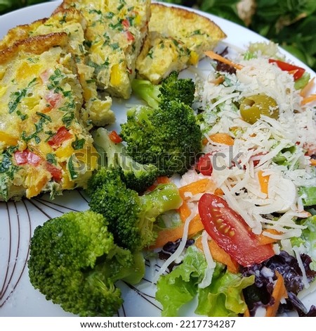 Low carbohydrate meal with omelette, boiled brocoli and fresh salad for healthy life. Paleo food. Simple lowcarb meal.